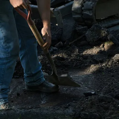 Digging-With-Shovel-Stock.jpg